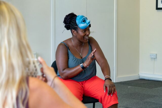 Practitioner, Liz, in conversation with her mask lifted