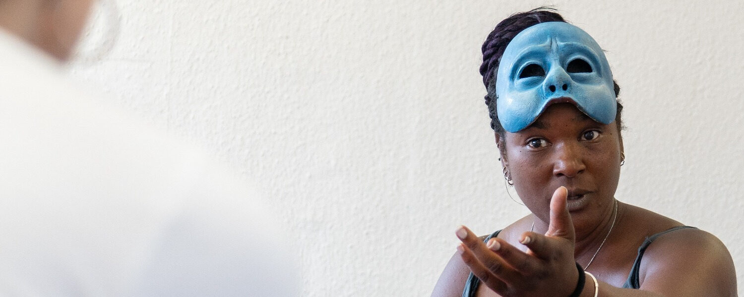 Practitioner, Liz, with her mask lifted