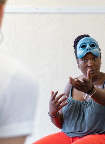 Practitioner, Liz, with her mask lifted