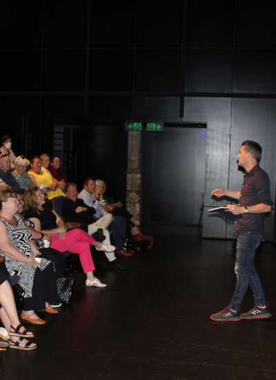 Andy delivers a talk at a symposium