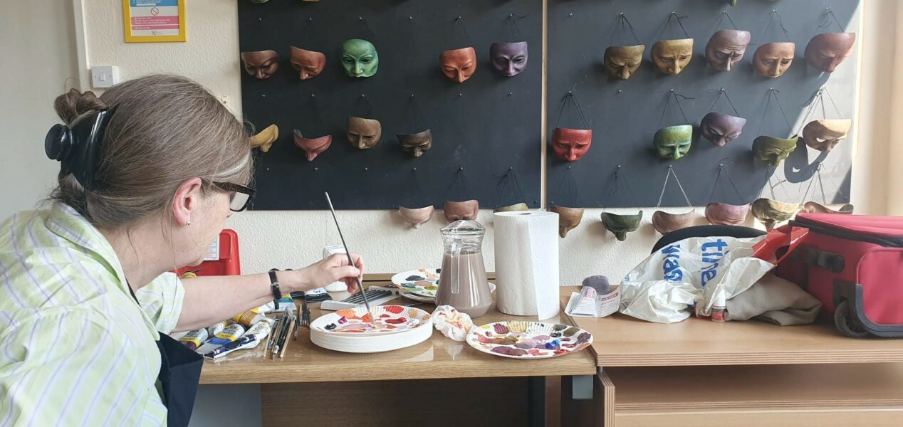 Sally Brookes paints masks at Geese HQ