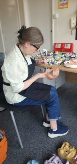 Sally Brookes paints masks at Geese HQ