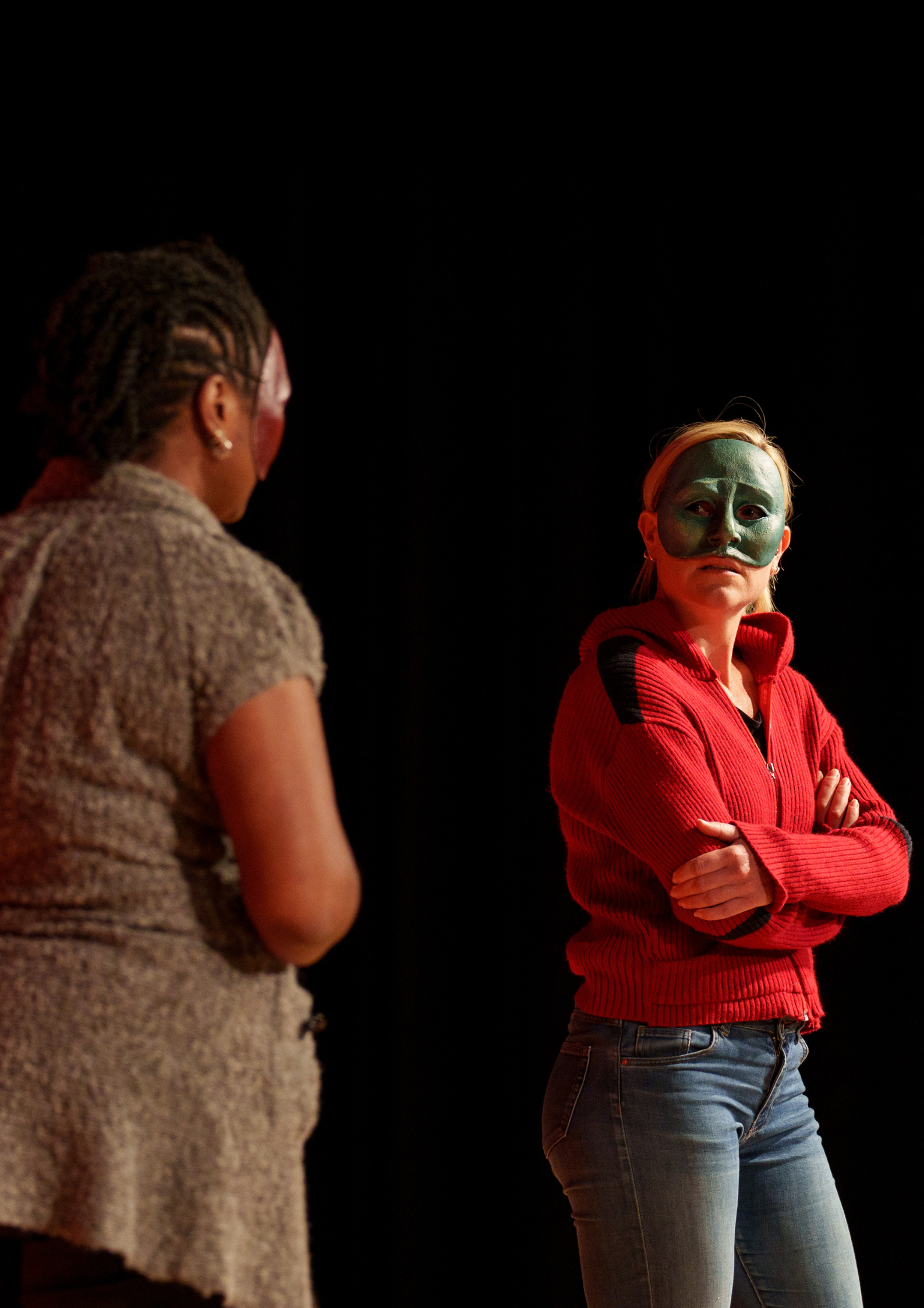 Two Geese practitioners, Liz and Emma, perform Conflict Zone in half masks
