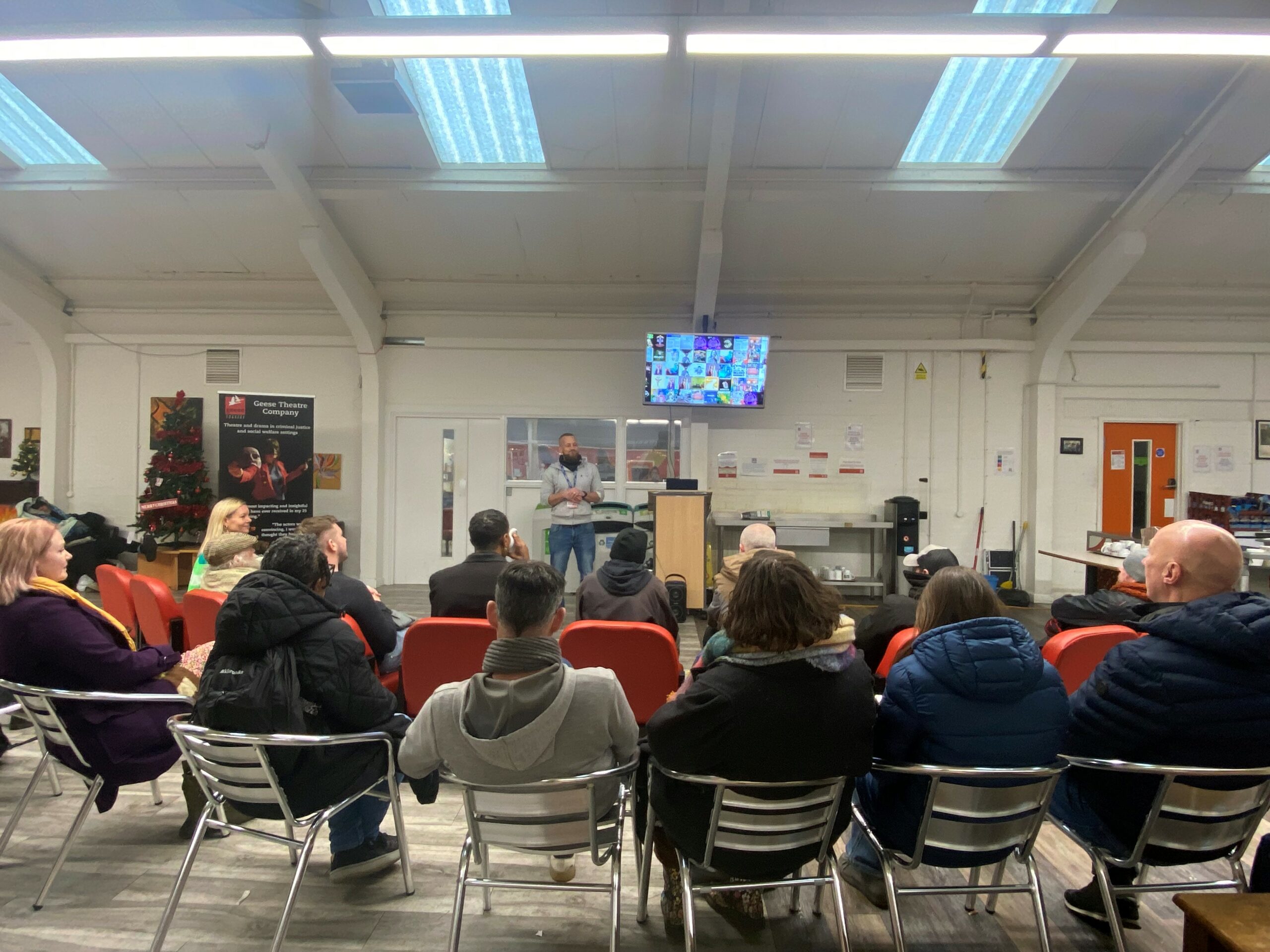 An audience gather at SIFA fireside to watch a film